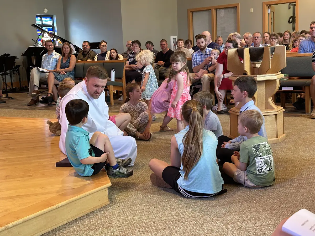 Children gathered at the front of the church for the children's message.