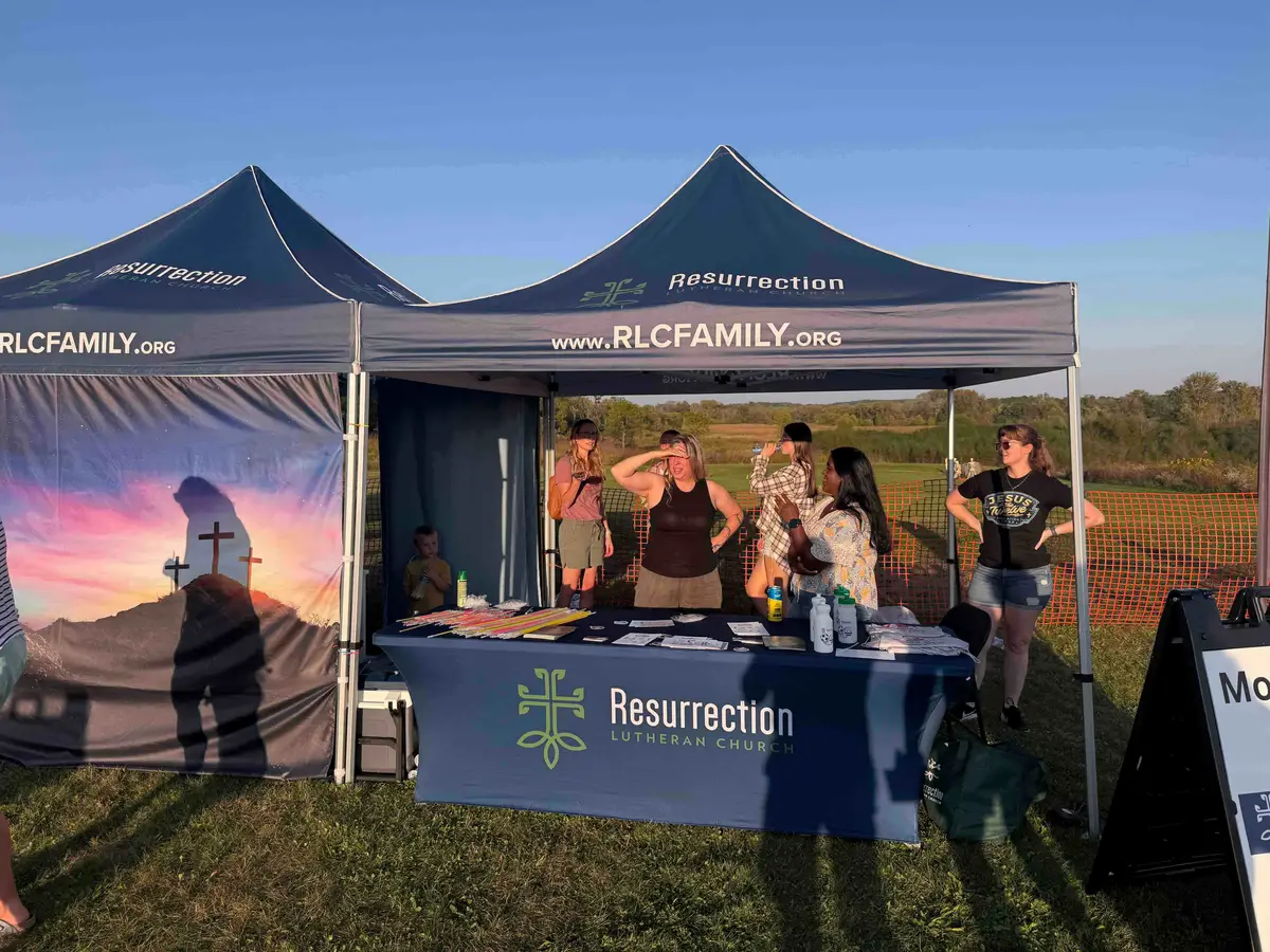 A Resurrection Lutheran tent at an outdoor fall festival.