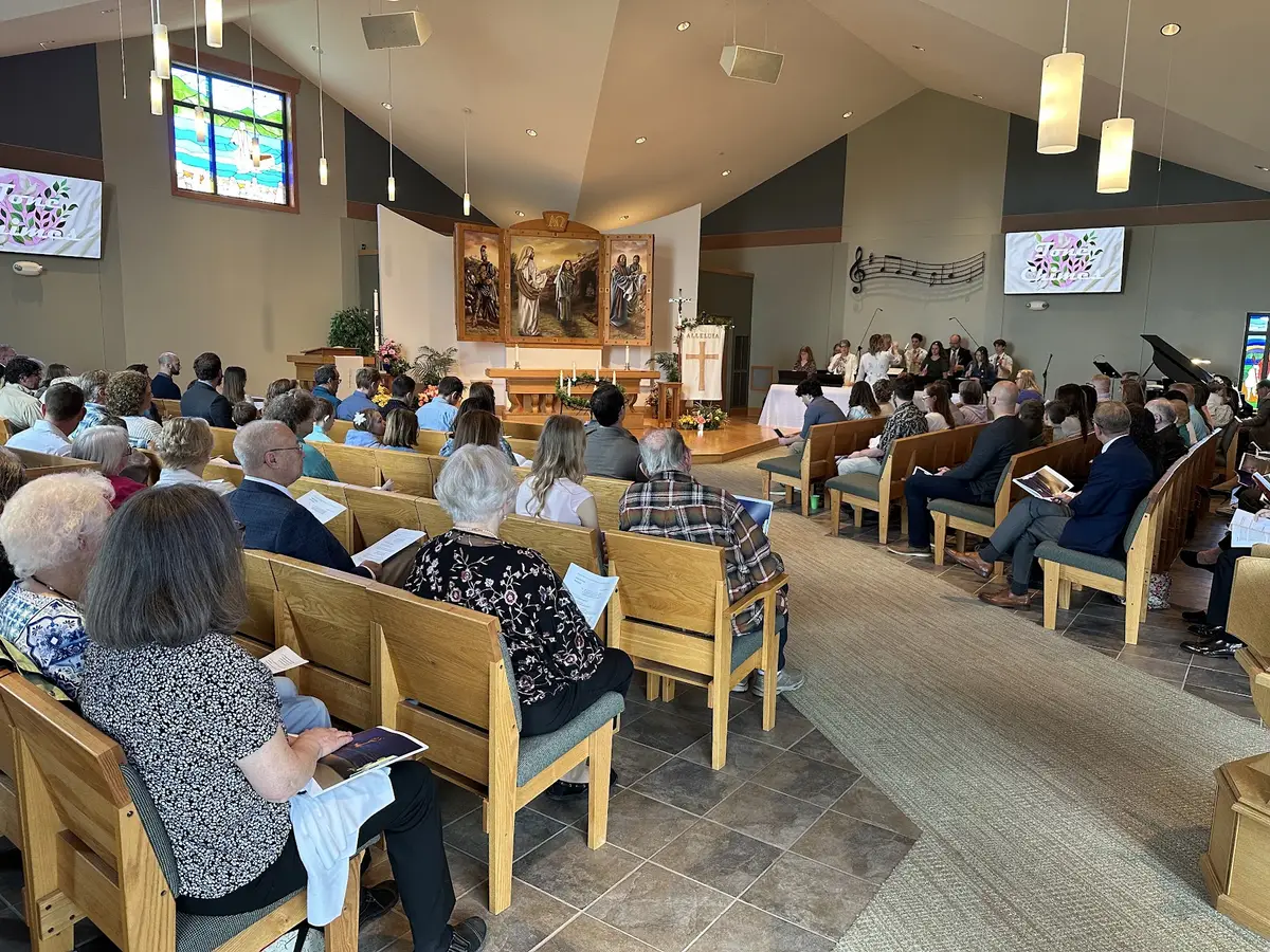 The Verona worship space during a service, with a screen on each side of the chancel.